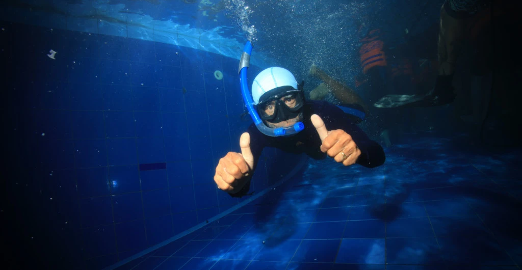 Happy diver in the pool